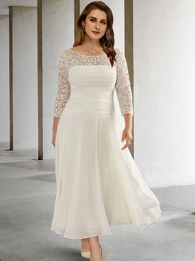 Elegant A-line plus size mother of the bride dress in chiffon with jewel neck and 3/4 sleeves, featuring ruched beading.