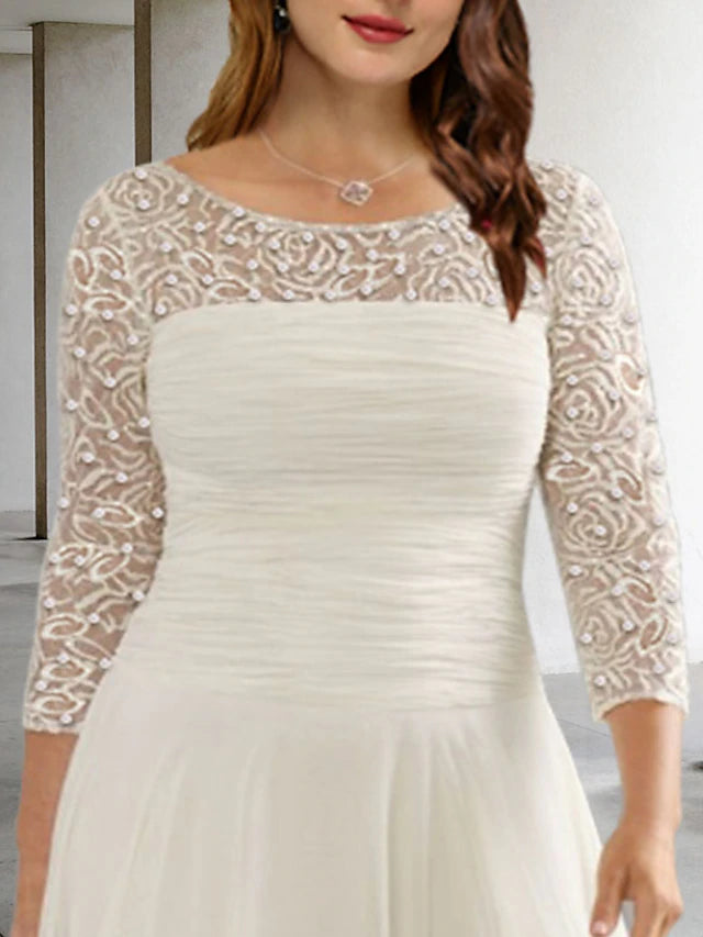 Back view of an elegant A-line plus size tea length dress with intricate ruched detailing and sequin embellishments.