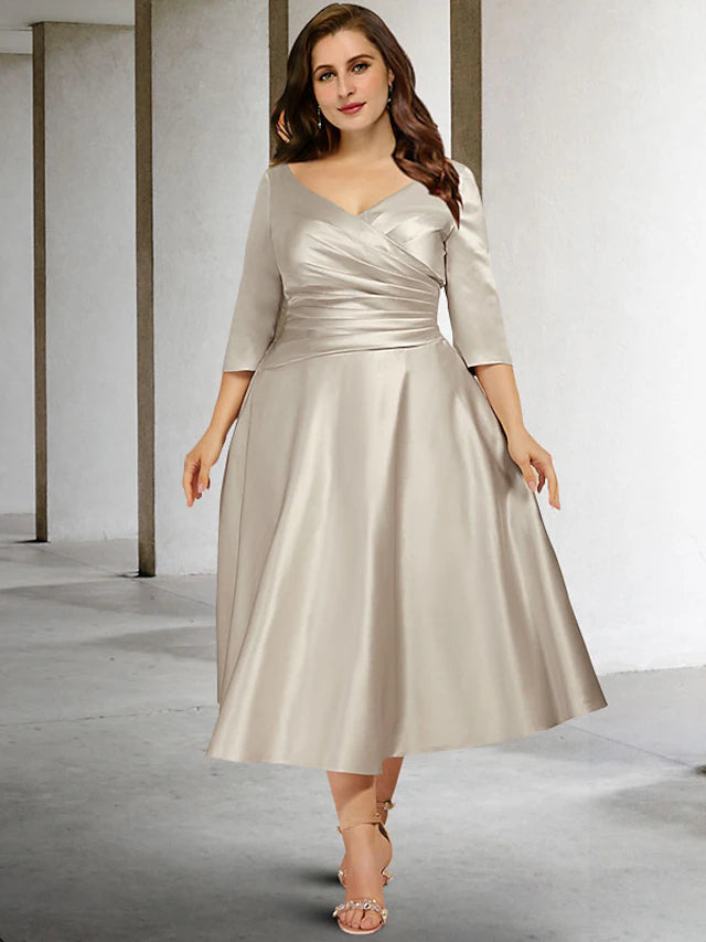 Front view of an elegant A-line plus size V-neck ruched satin tea length dress.