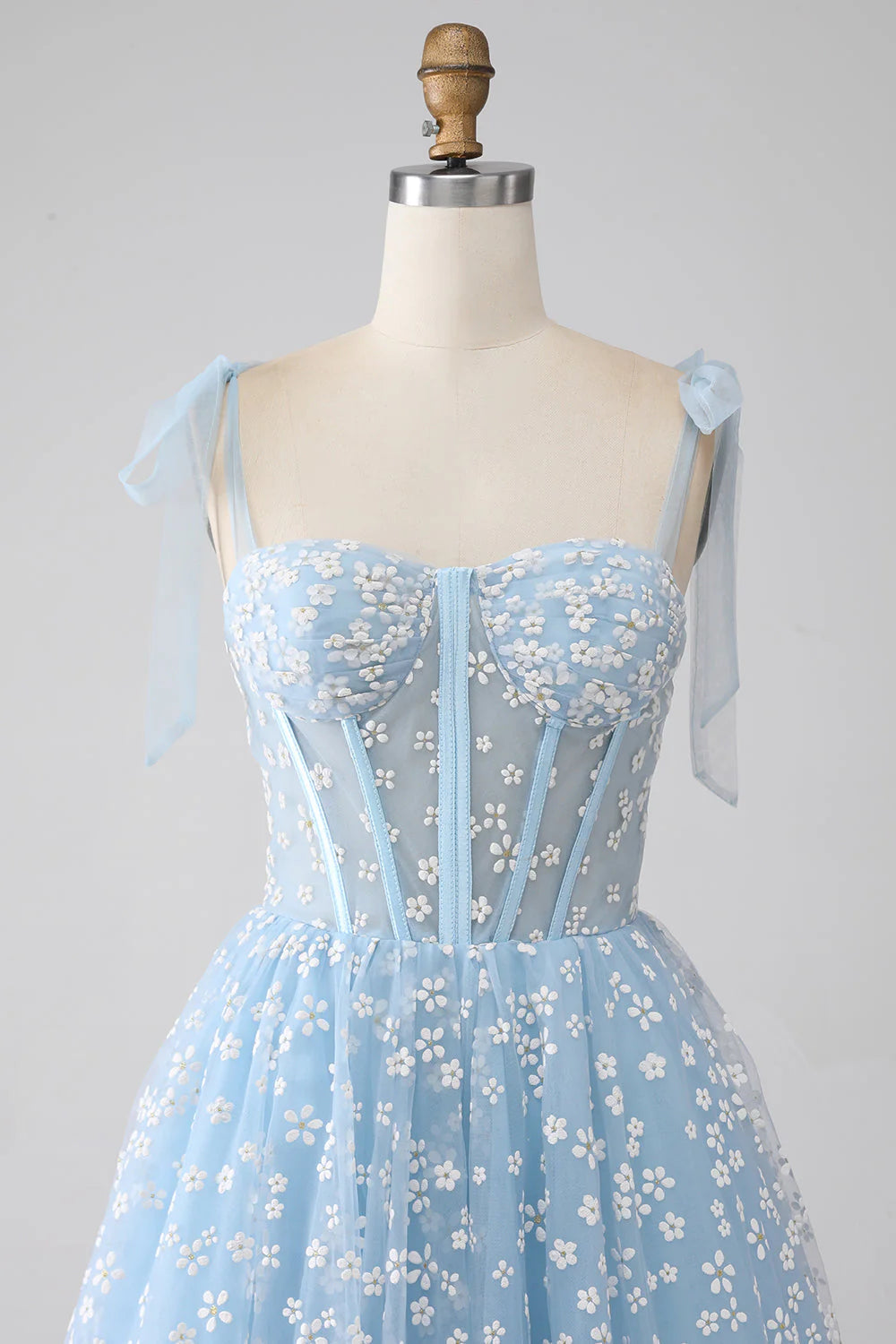 Close-up of the print and pleated tiers on the A-Line prom dress.