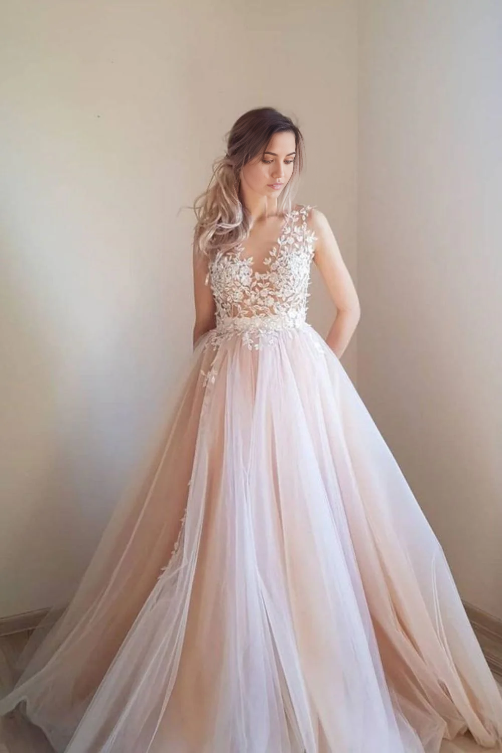 Elegant pink A-line prom dress with delicate appliques, front view.