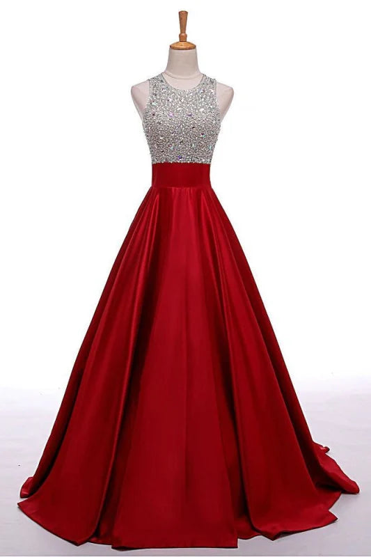 Model wearing an A-line round neck sleeveless prom dress with intricate beading.