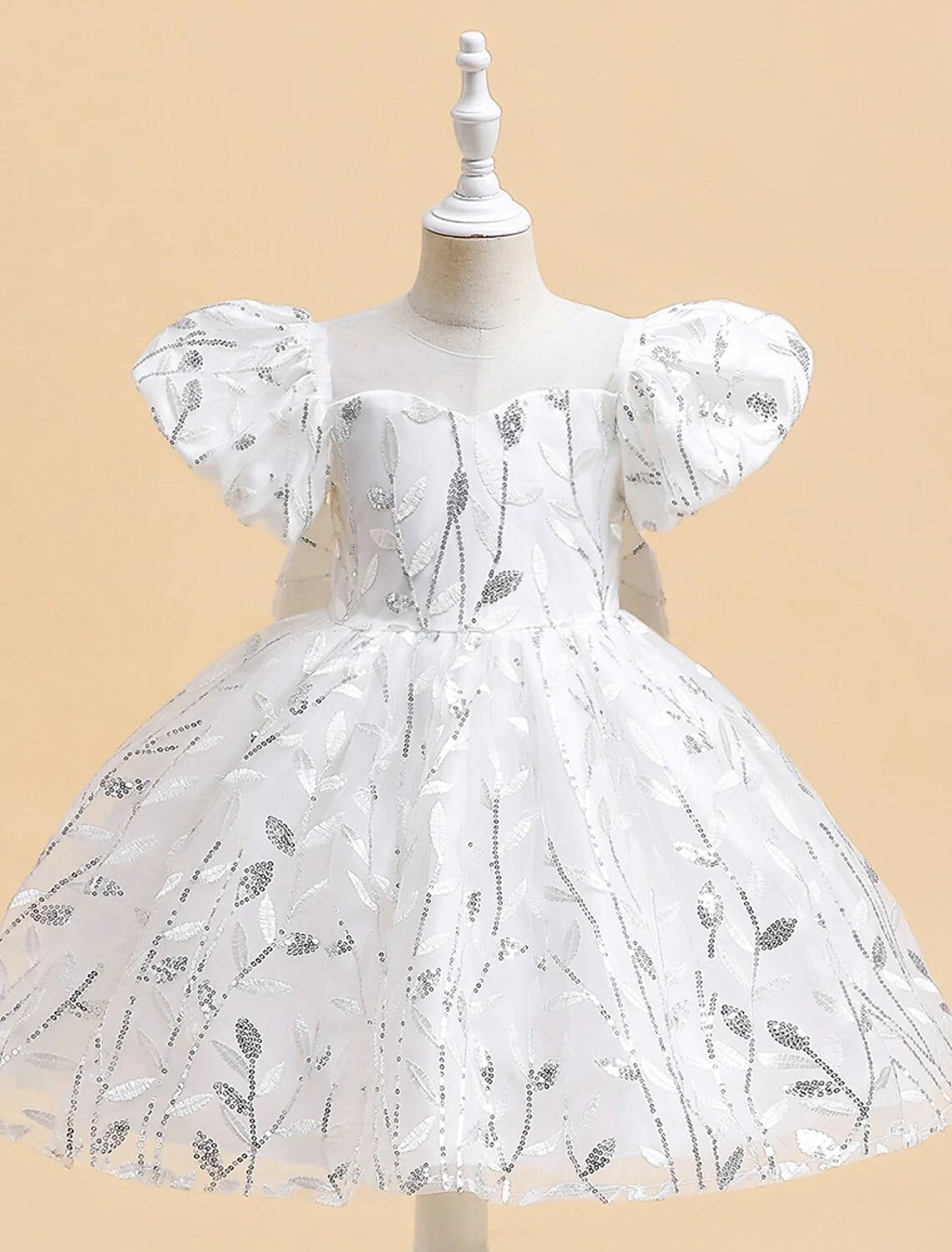 White knee-length princess flower girl dress with round neck and embroidery.