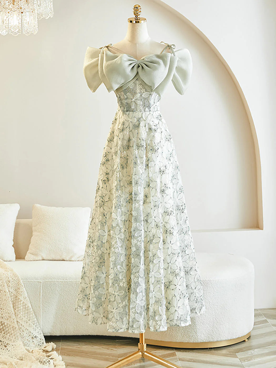 Elegant A-line tea length prom dress with lace bodice and flowy skirt.