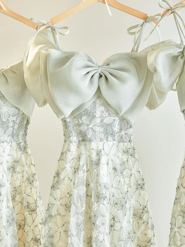 Side view of the ivory A-line tea length prom dress.