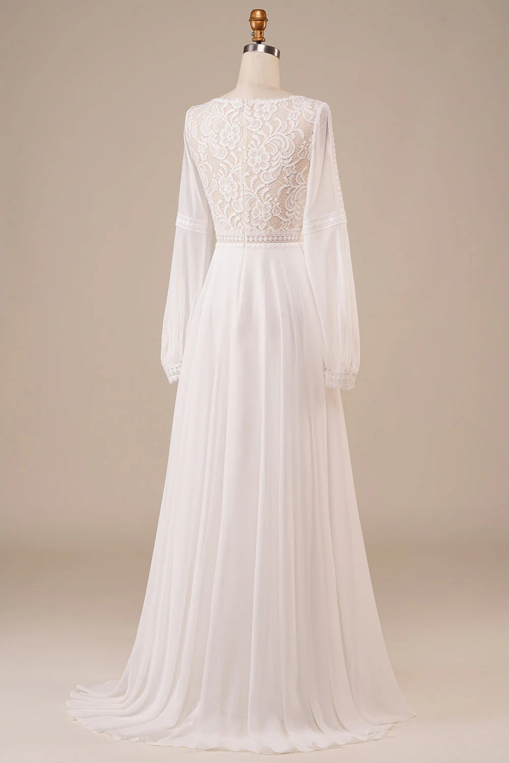 Side view of an ivory wedding gown showcasing intricate lace details on long sleeves.