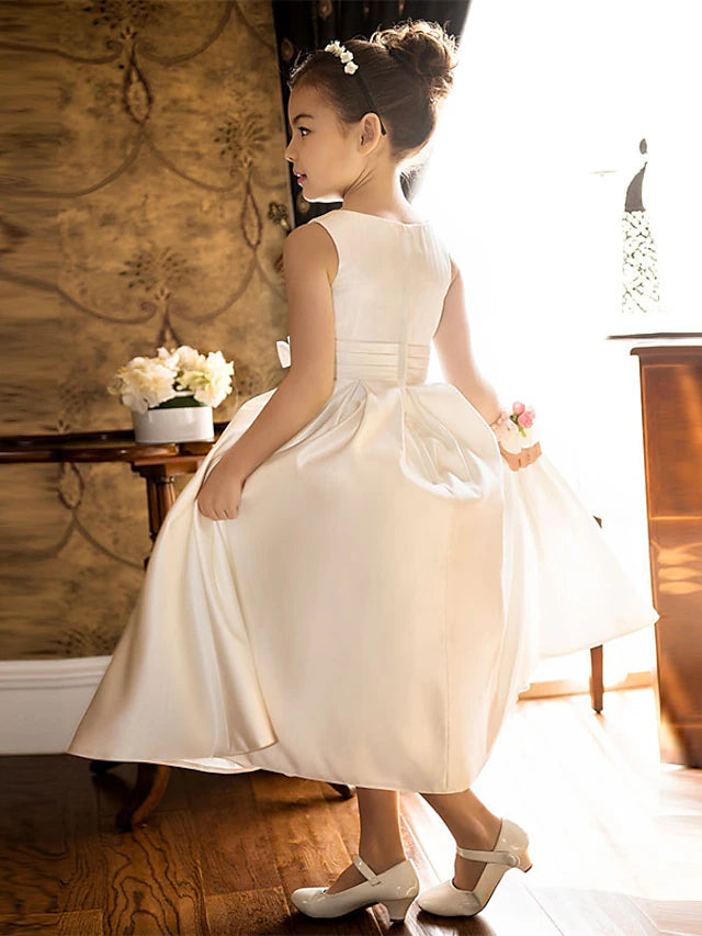 Full length view of a girl in a blue satin special occasion dress.