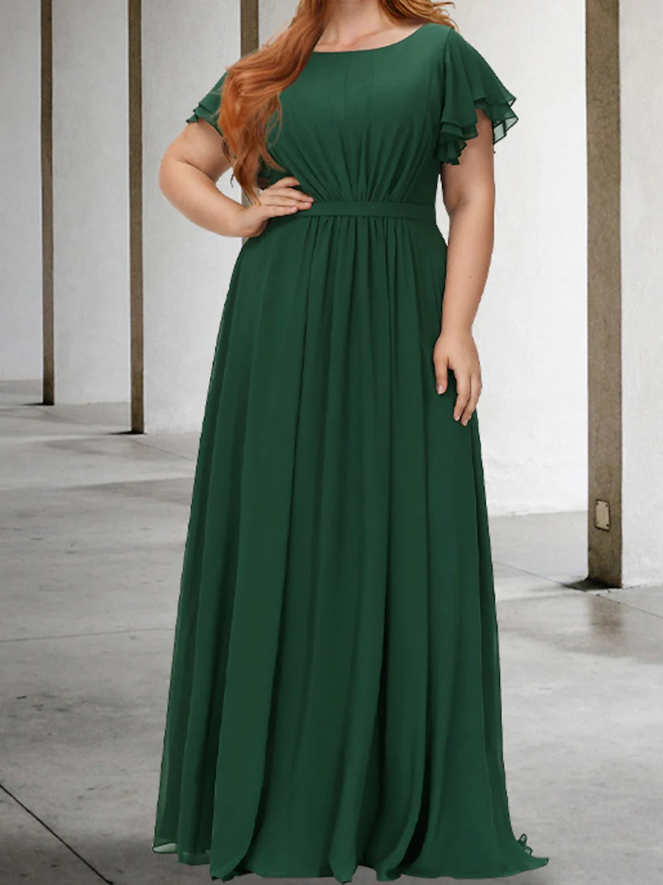 Woman wearing an elegant A-line short sleeve knee-length dress.