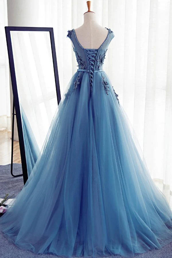 Close-up of the lace bodice and round neckline of the prom dress.