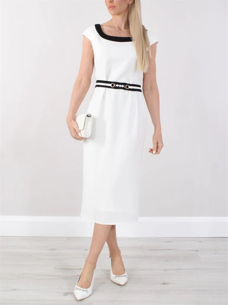 Elegant A-line tea length mother of the bride dress with a round neck and short sleeves, worn by a model.
