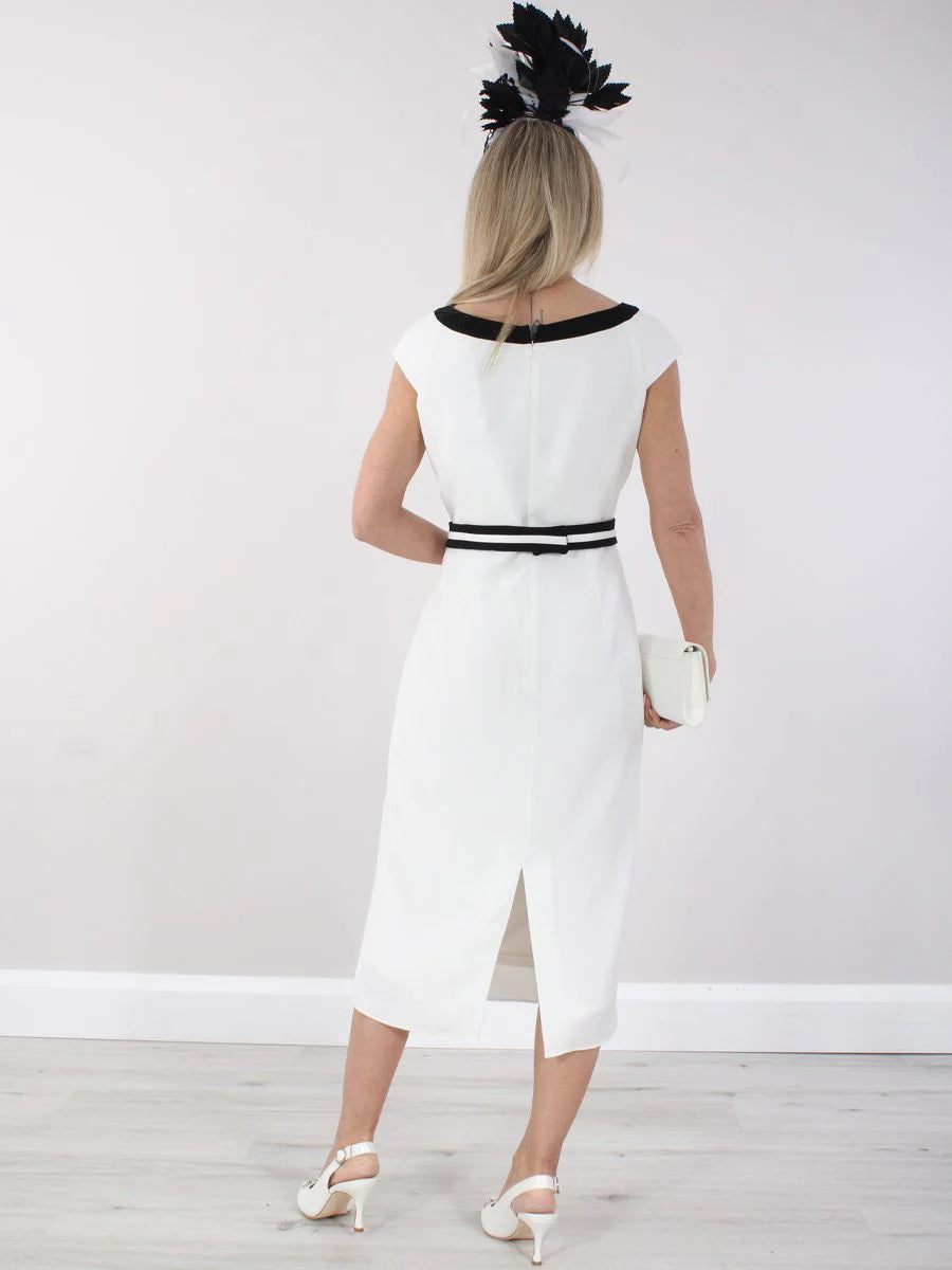 Model showcasing the back view of an A-line tea length formal dress with a round neck.
