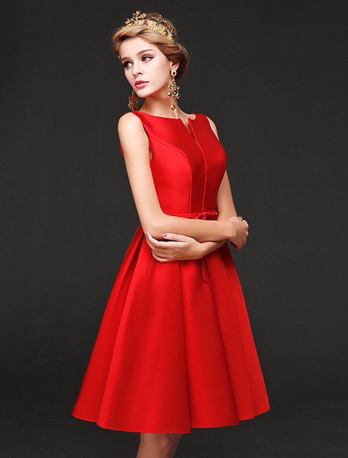 Side profile of a short A-line homecoming dress in satin.