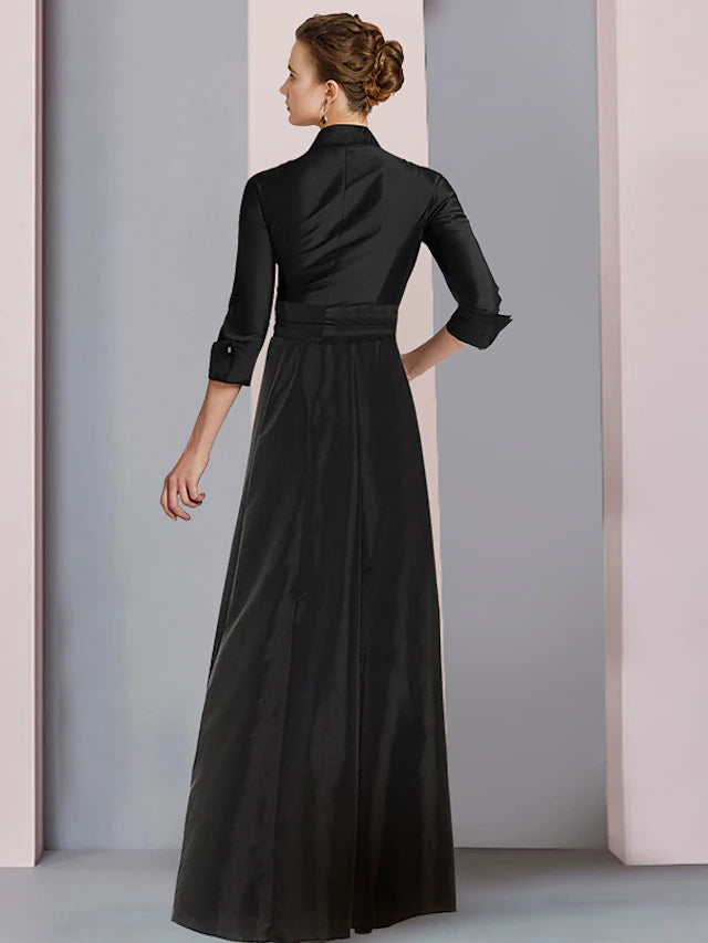 Elegant asymmetrical floor-length gown featuring a shirt collar and pleats.