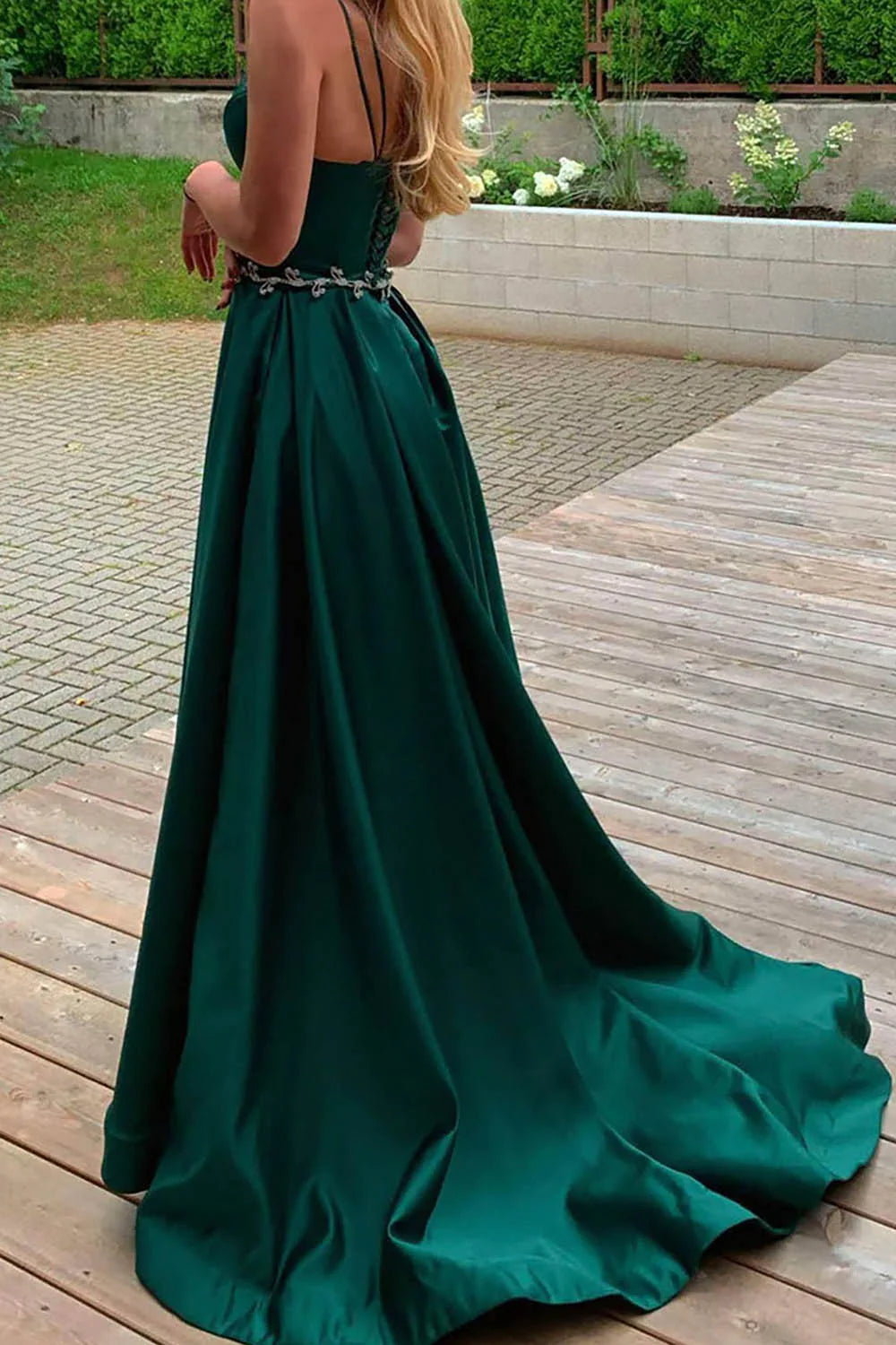 Back view of an A-Line satin long dress with spaghetti straps, showcasing the elegant drape and V-neckline.