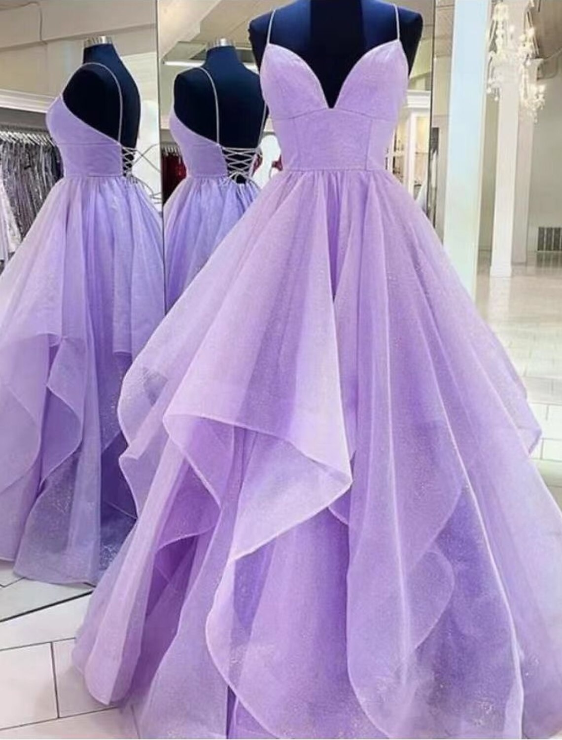 Elegant A-Line satin prom gown with spaghetti straps and ruffles.