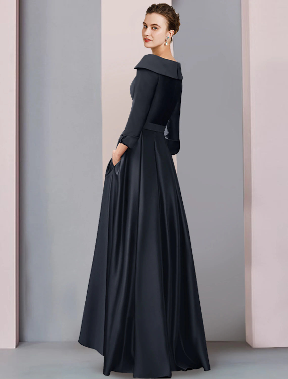A-line satin tea length dress featuring a high-low hem and pleats.