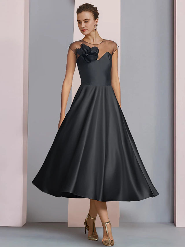 Elegant A-Line satin tea length dress with half sleeves and scoop neck.
