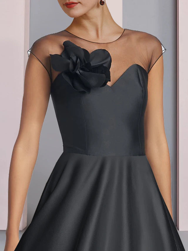 Back view of elegant satin tea length formal dress.