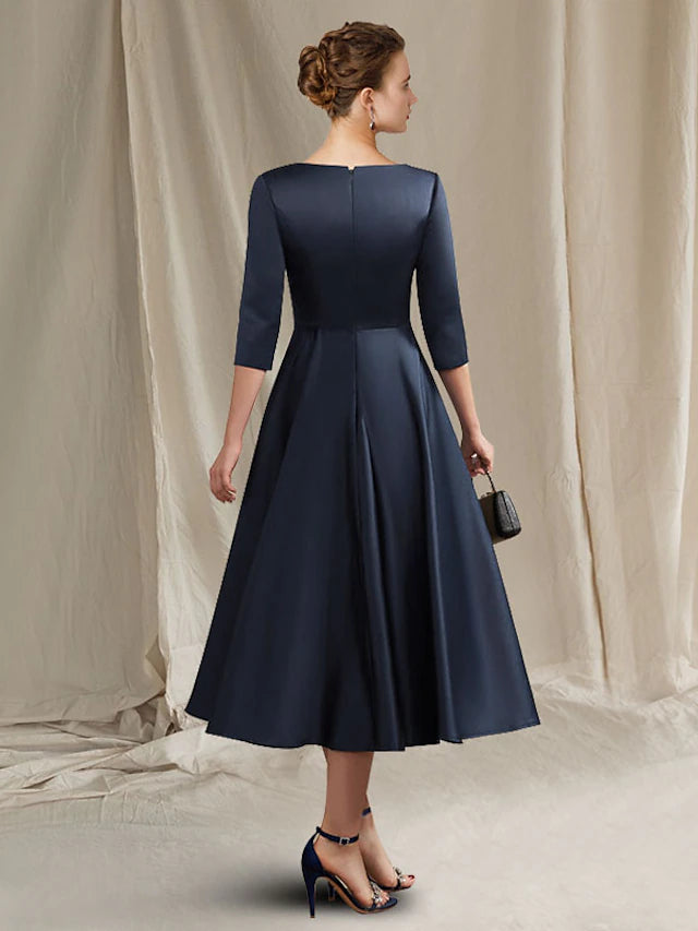 Side view of A-Line satin dress, highlighting pleated skirt and ruched bodice.