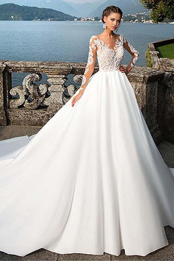Elegant A-line satin V-neck wedding dress with delicate lace appliques.
