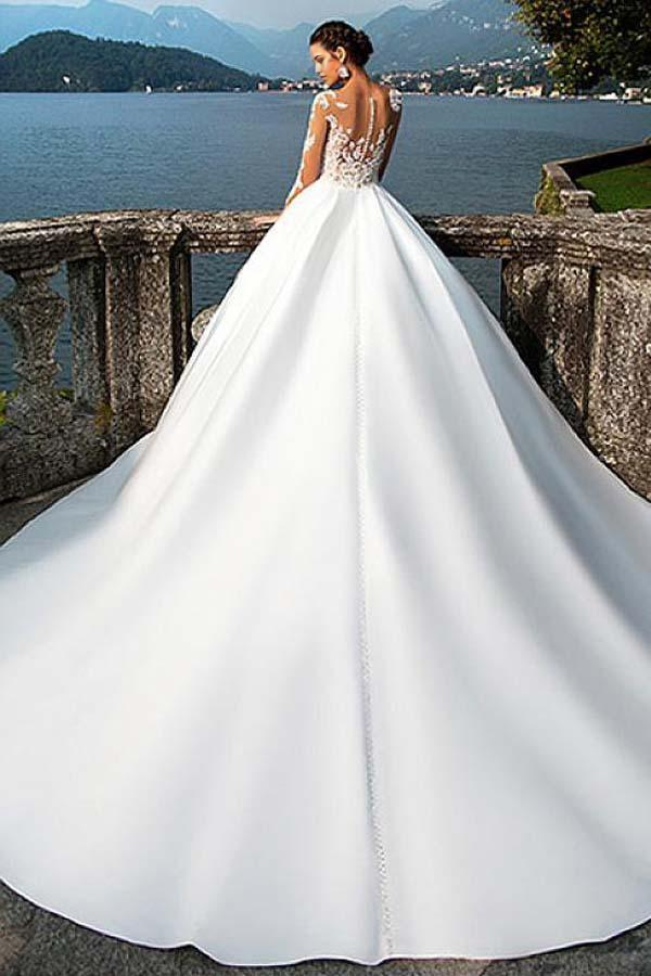 Side view of the A-line satin V-neck wedding dress, showcasing the flowing skirt.