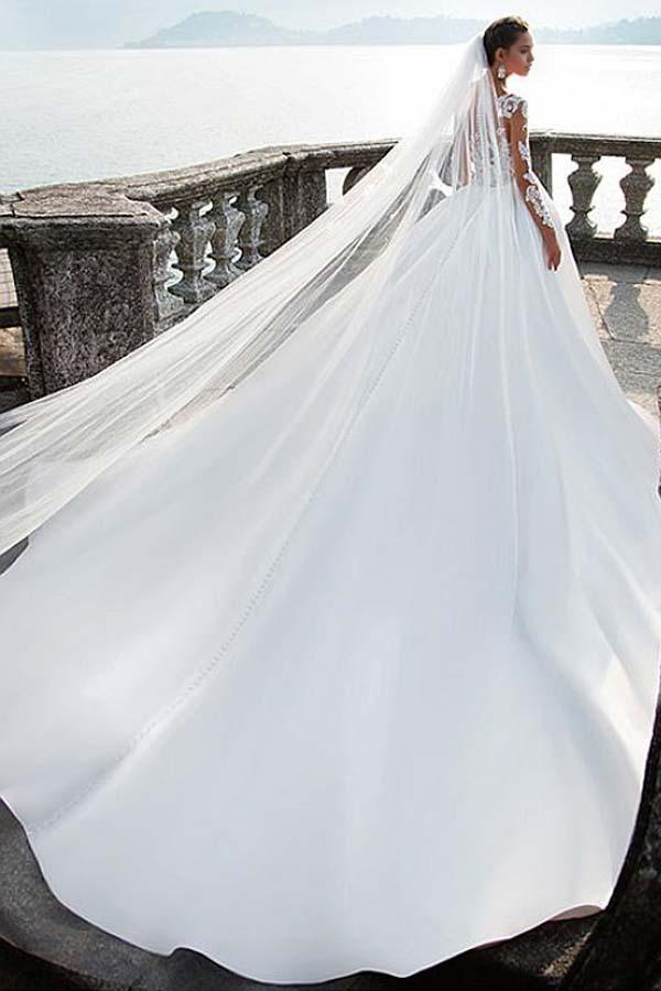 Back view of the A-line satin V-neck wedding dress, highlighting the train and lace details.