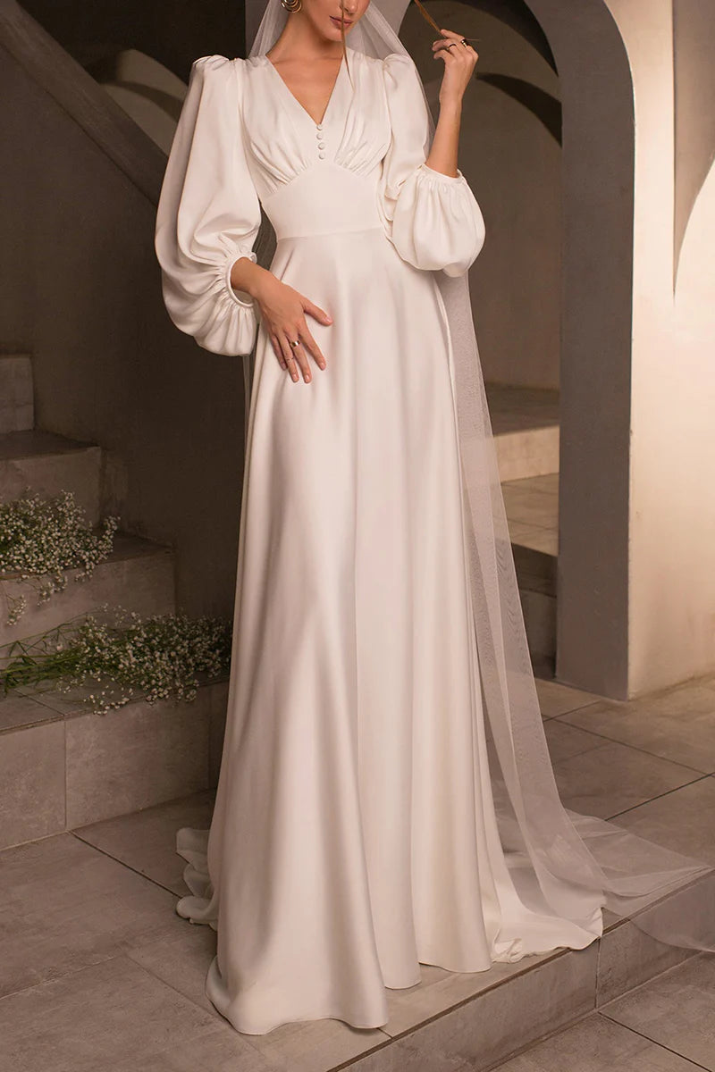 Full length view of the A-line satin wedding dress, emphasizing its beautiful sweep train.