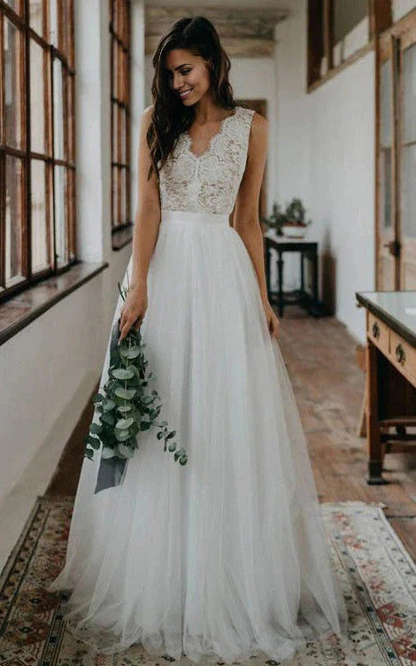 Full view of an elegant A-line lace wedding dress with a scalloped V-neckline.