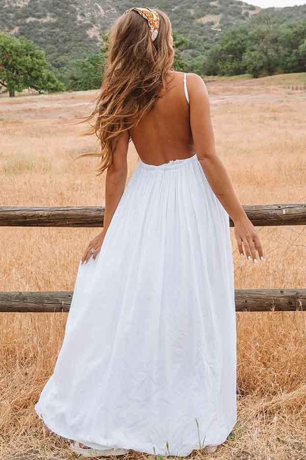 Romantic floor-length bridal gown with delicate lace for beach weddings.