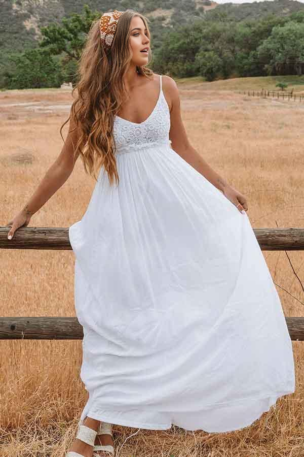 White A-line wedding dress featuring a scoop neckline and open back.