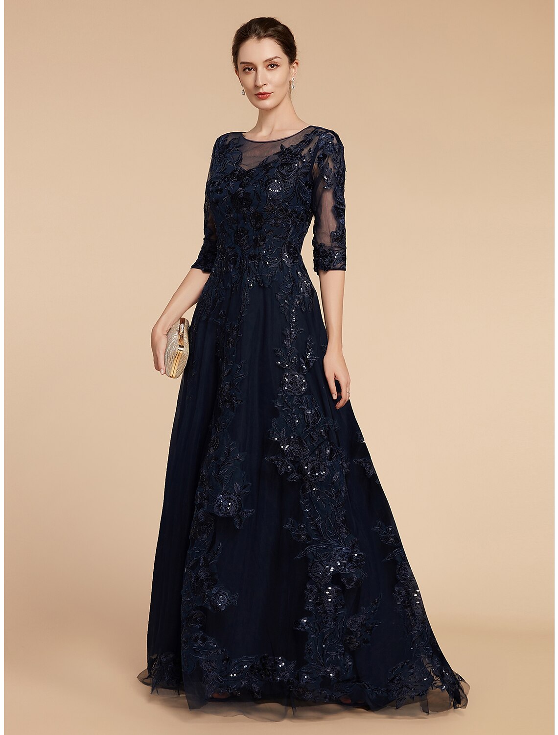 Side view of a woman wearing a floor-length A-line formal dress.