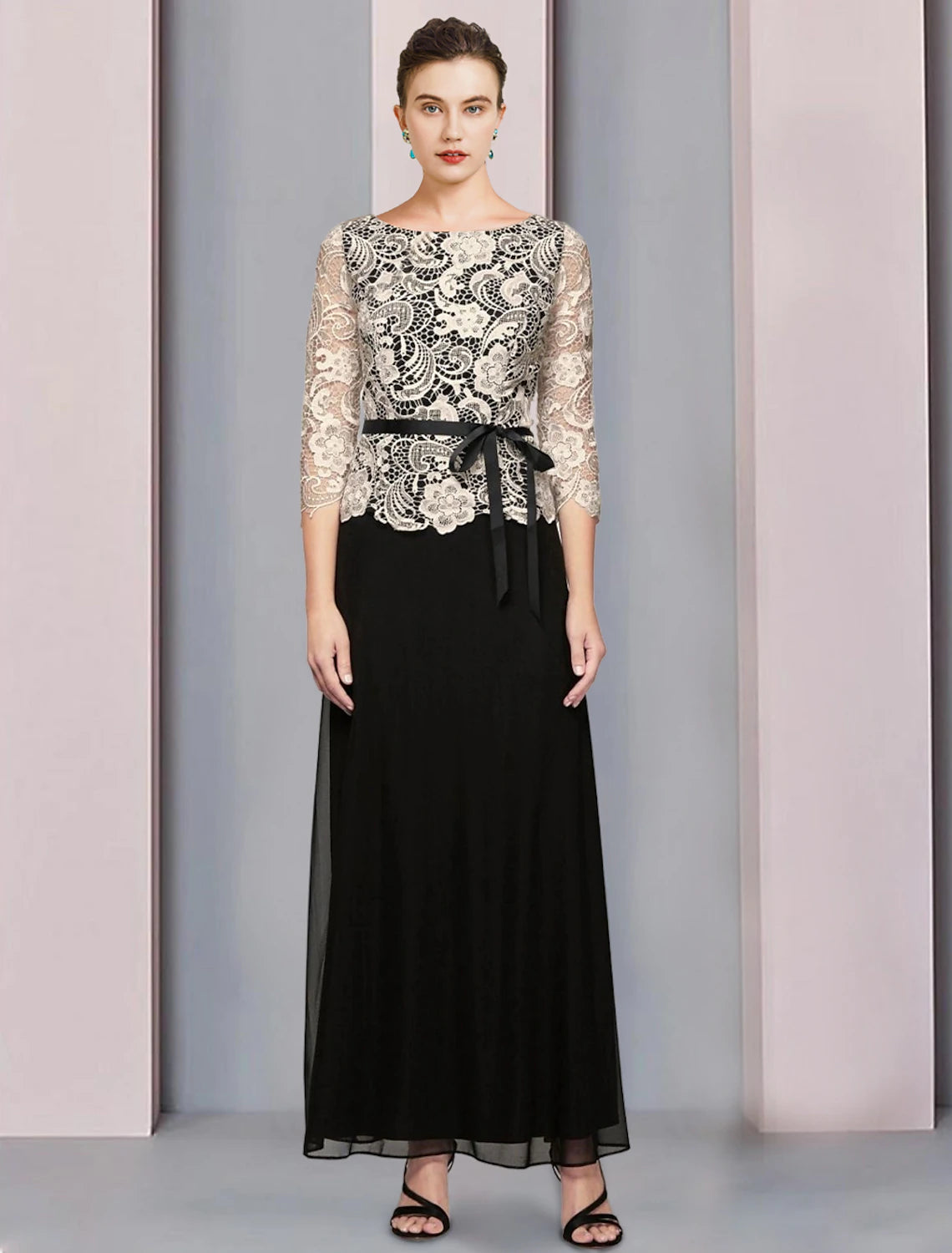 Woman wearing an elegant blue A-line Mother of the Bride dress with scoop neck and 3/4 sleeves.