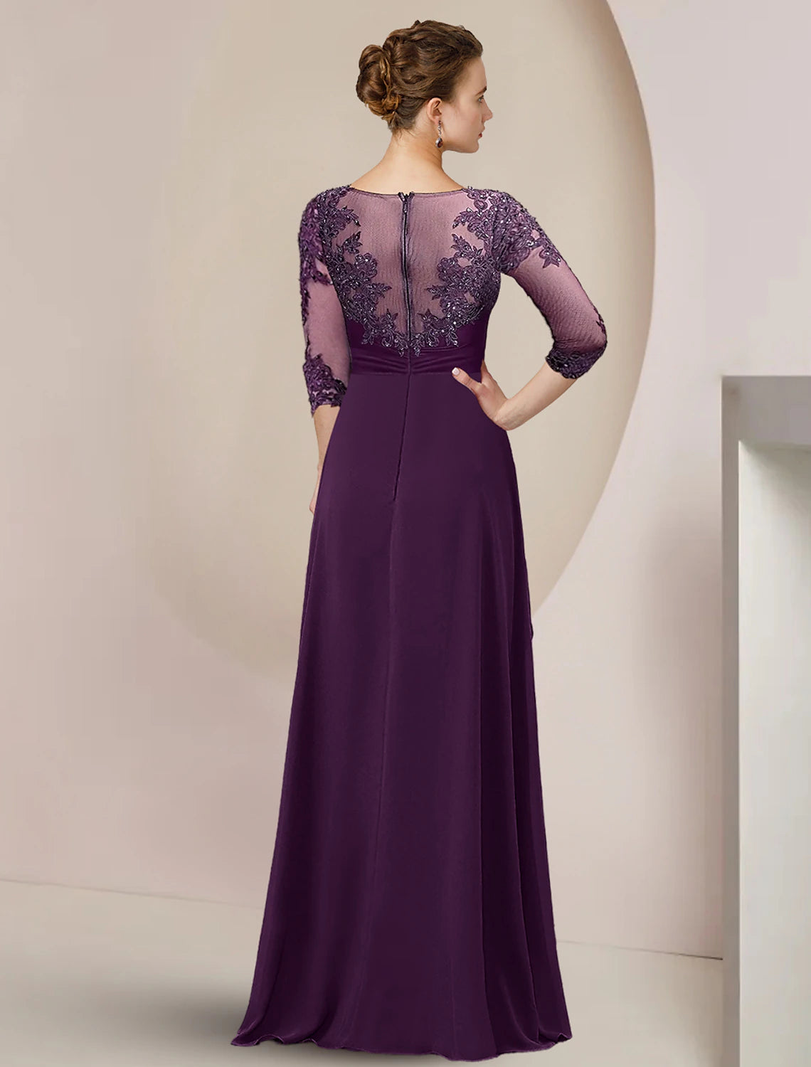 Close-up of the lace and beaded details on the 3/4 sleeve formal gown.