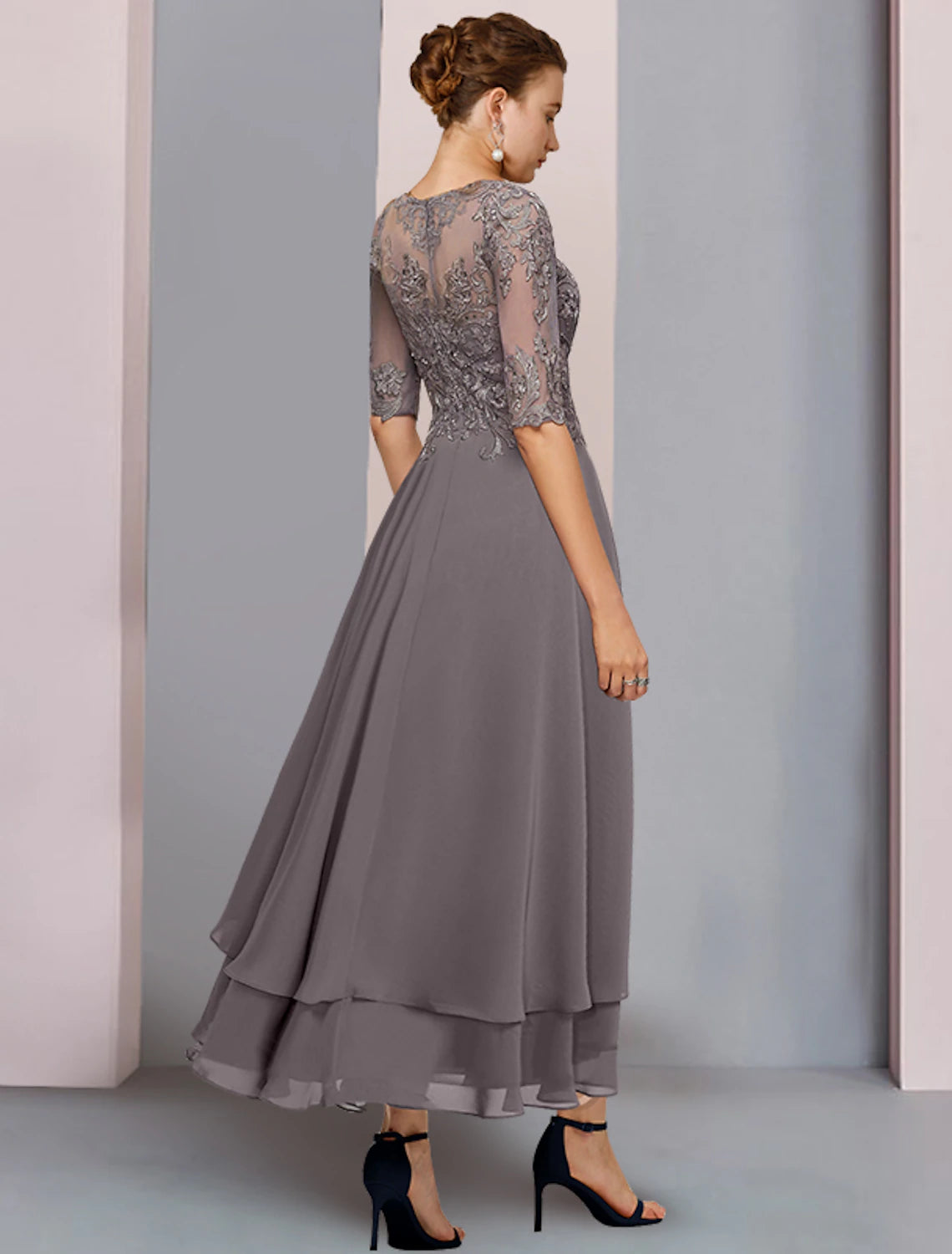 Back view of the A-Line tea length gown showing chiffon lace and appliques.