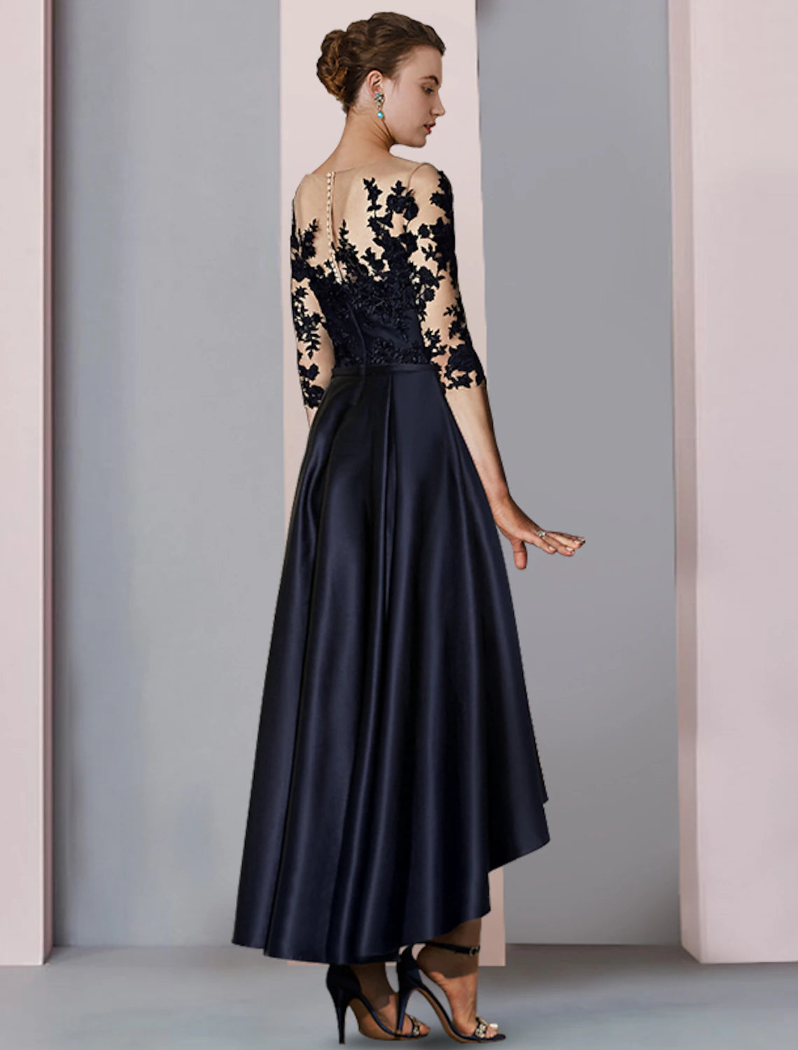 Close-up of dress details showing pleats and appliques.