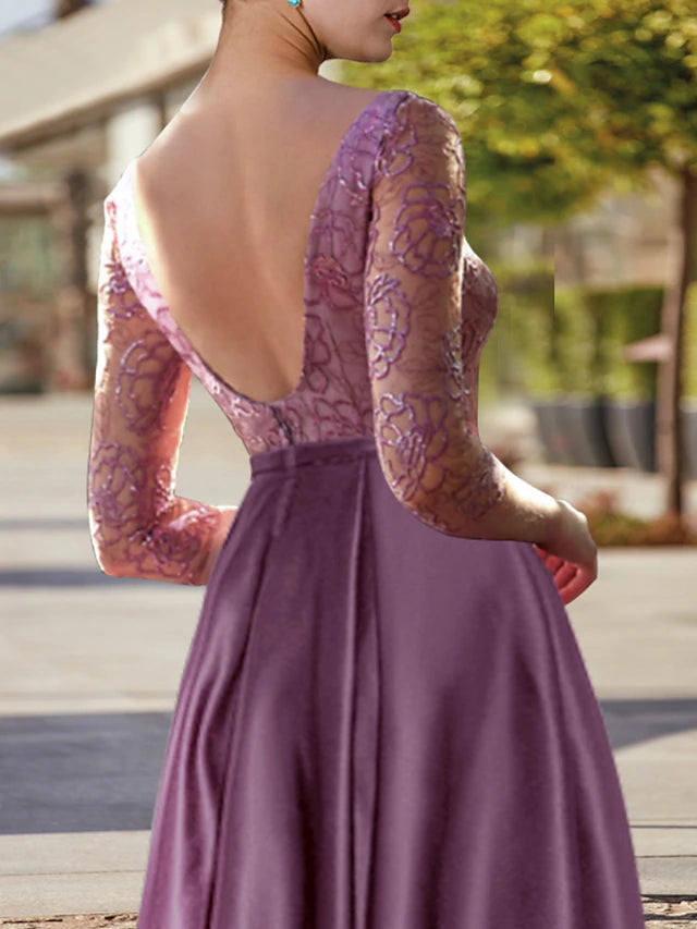 Back view of the satin lace dress with pleats and appliques.