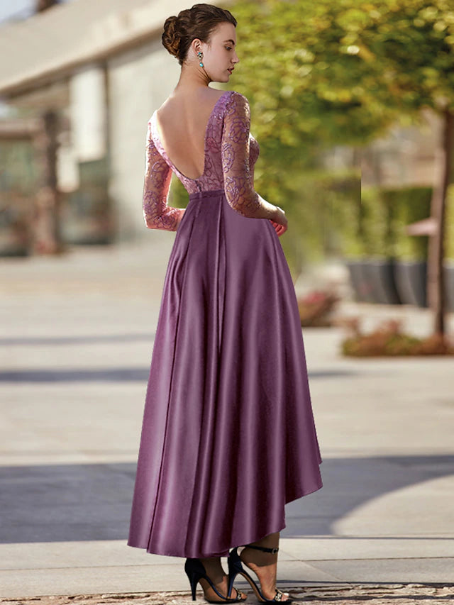 Detail of the appliques and lace on the elegant wedding guest dress.