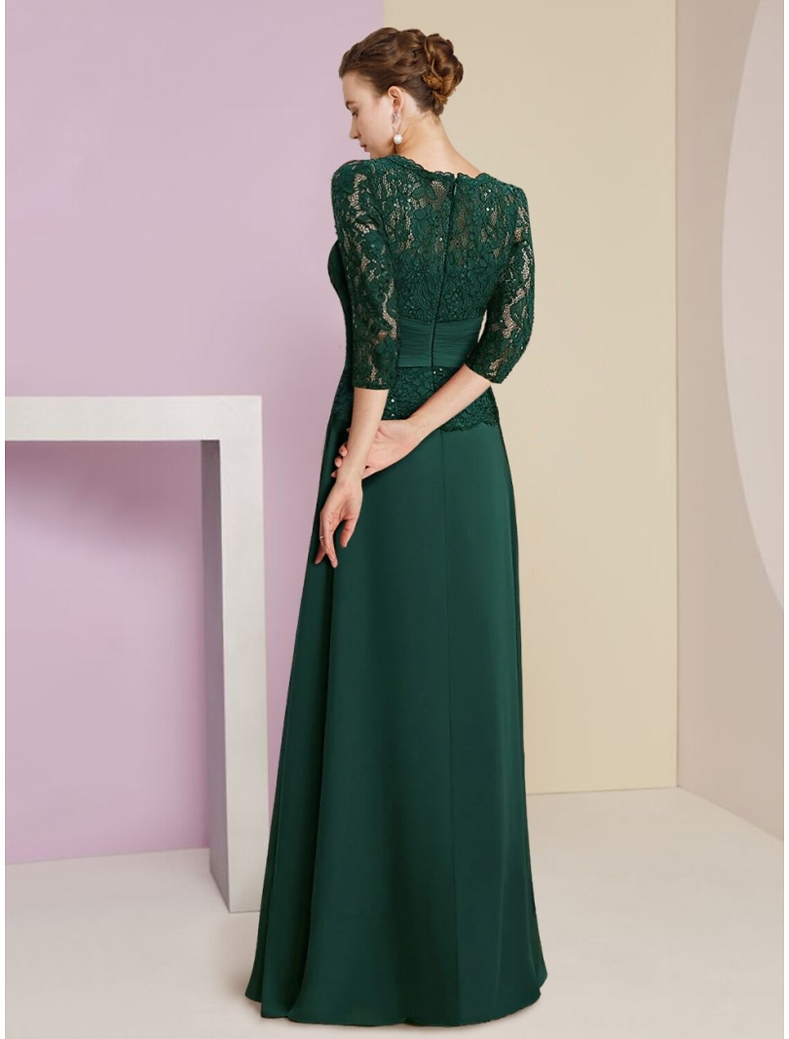 Back view of the A-line formal gown, showcasing lace and sequin details.