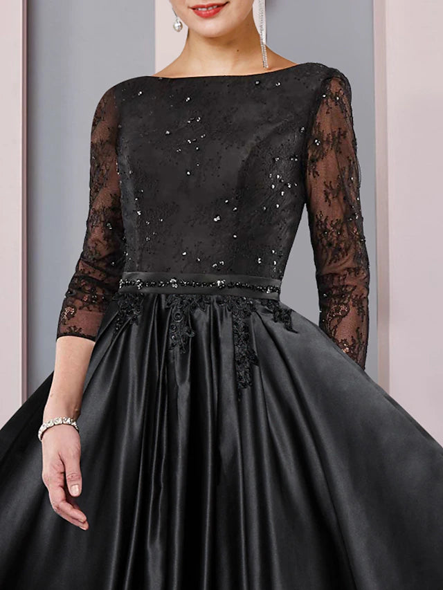 Back view of the elegant A-Line tea length dress, showing the sash detail.