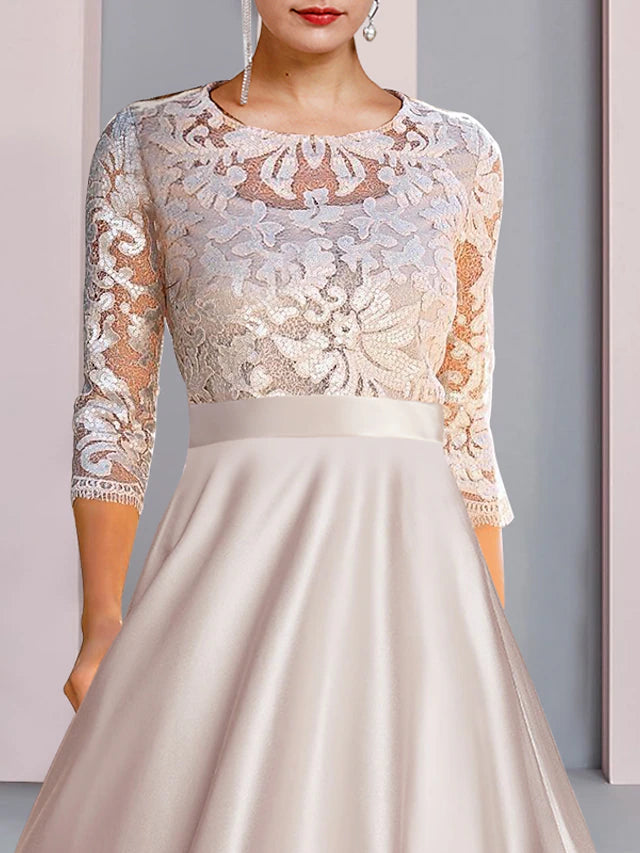 Tea length satin and lace Mother of the Bride gown with intricate appliques.