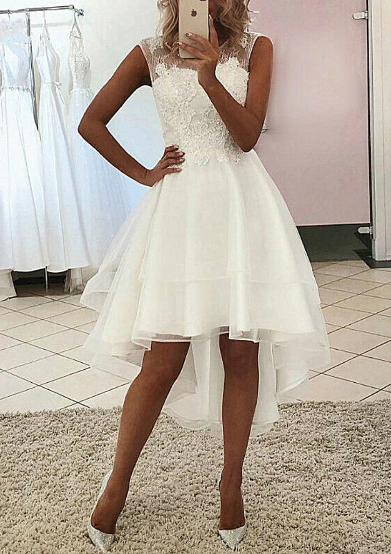 Elegant A-Line wedding dress with scoop neck and asymmetrical lace details.