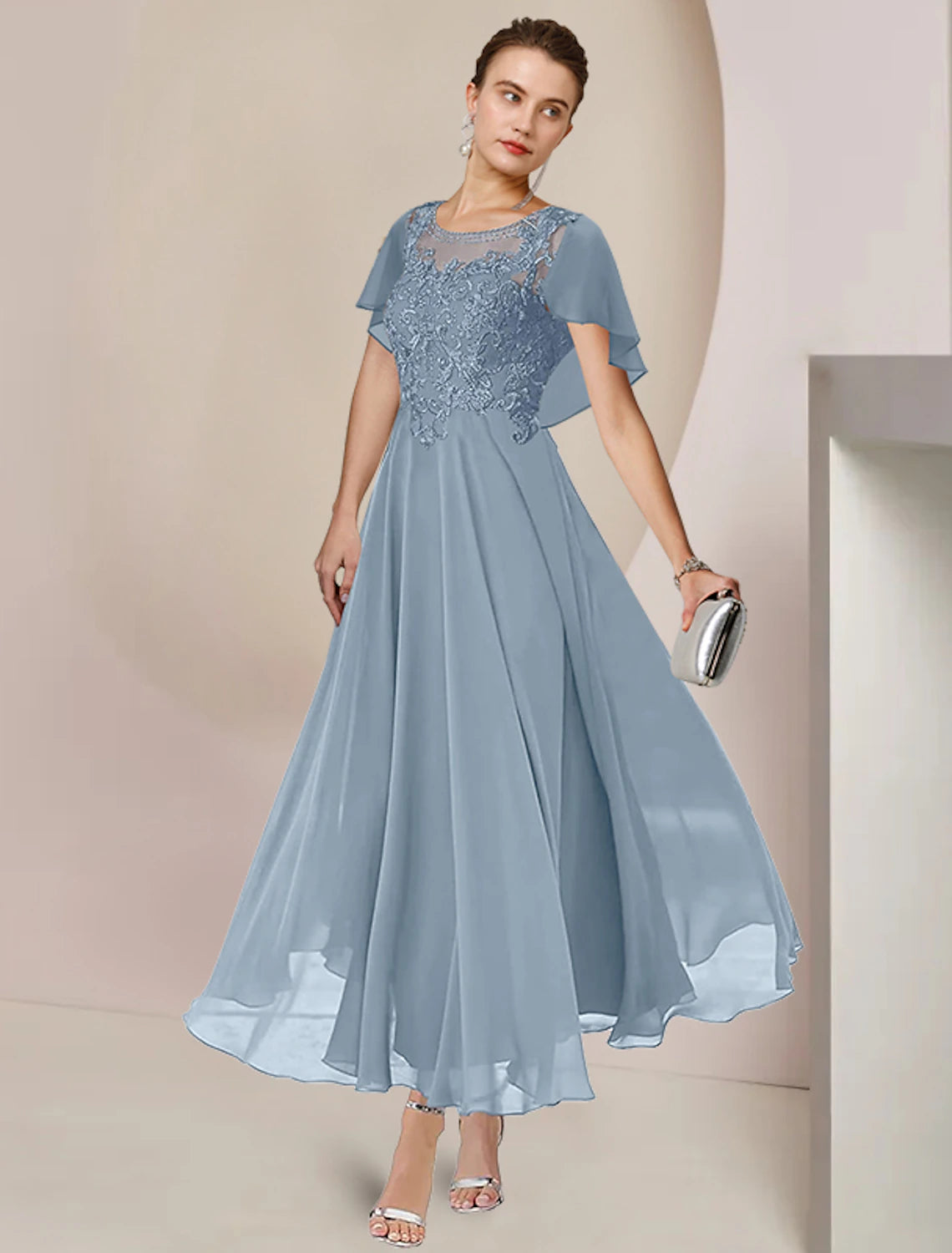 Back view of the sleeveless A-Line tea length dress.