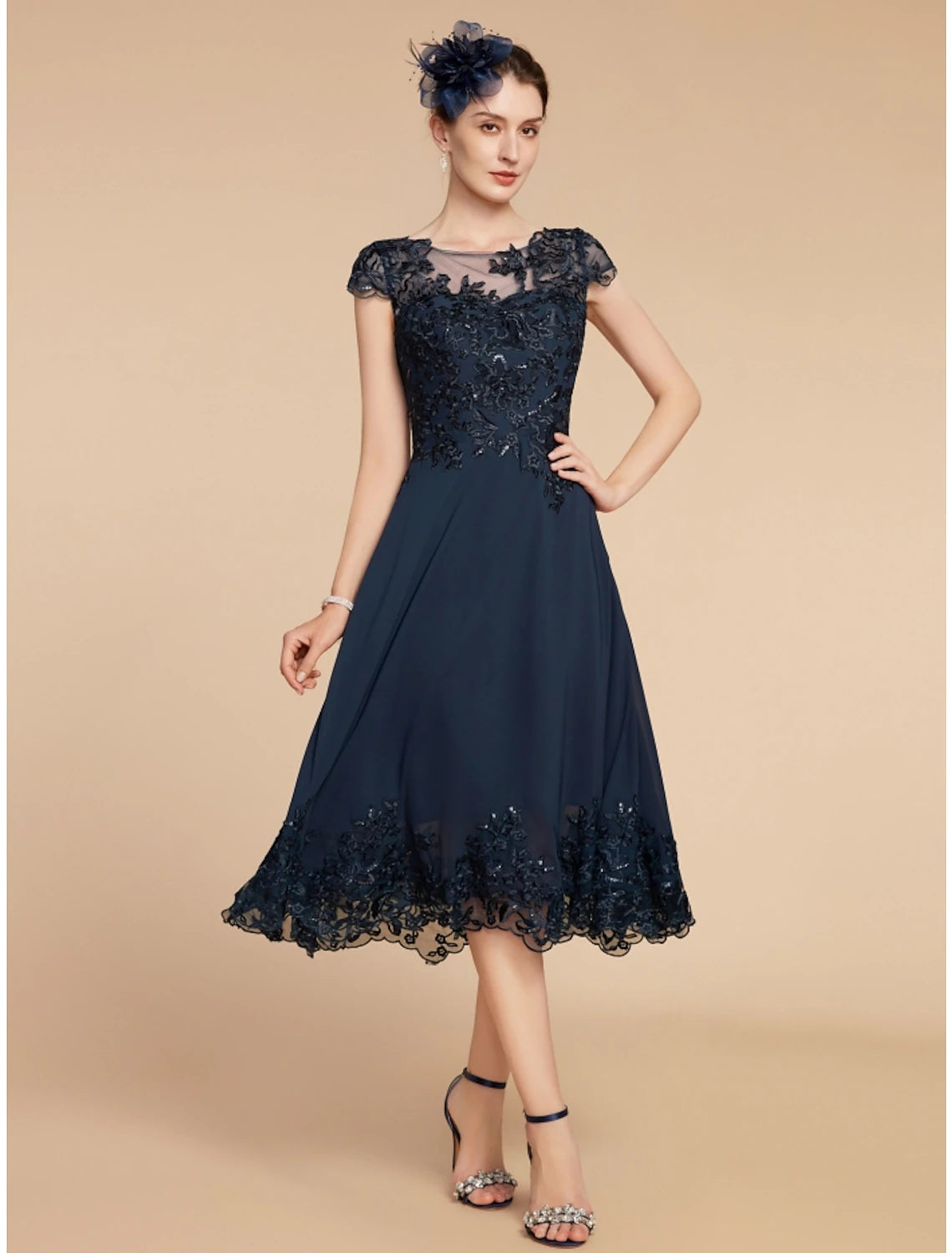 Close-up of the chiffon-lace fabric and sequin ruching detail on the dress.
