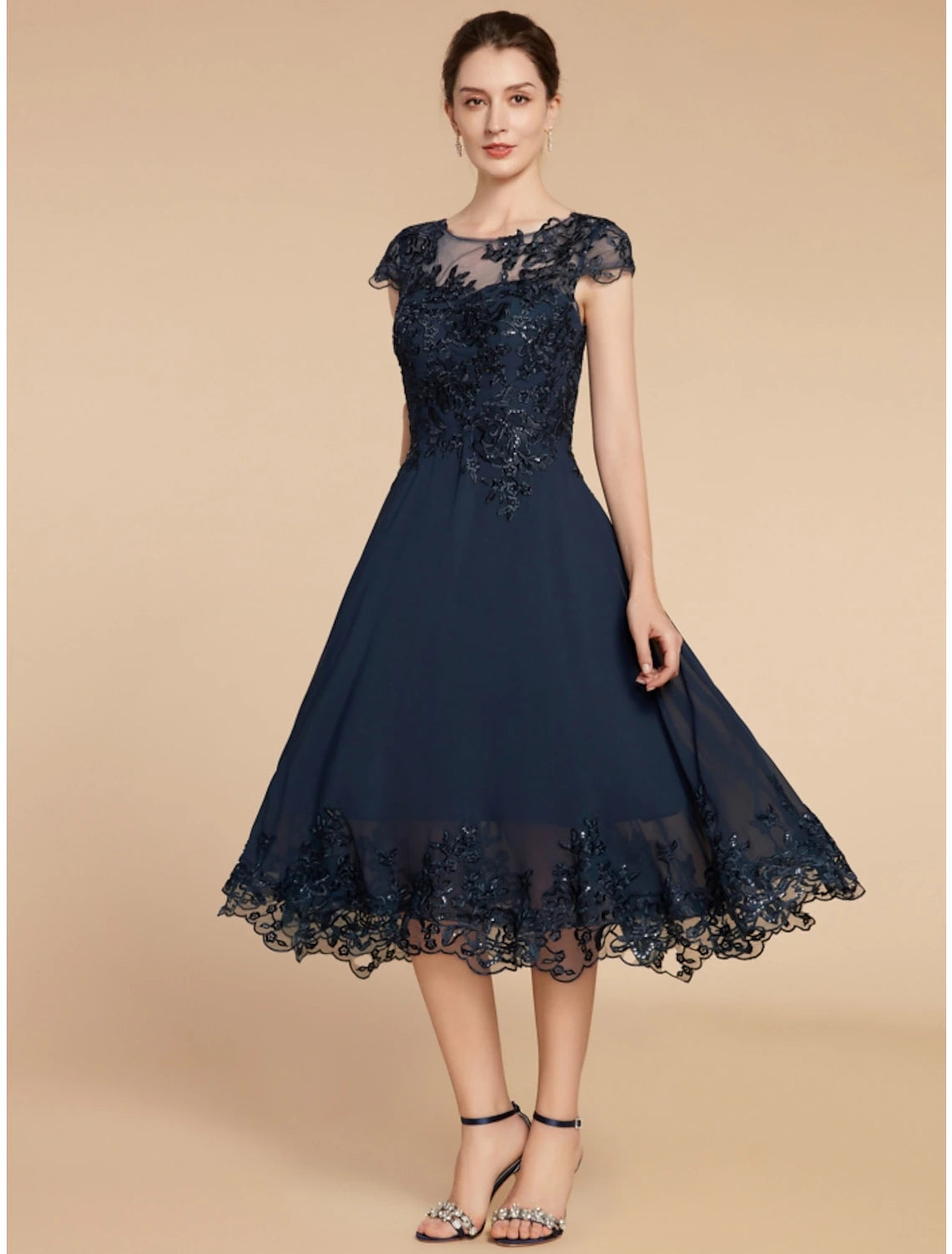 Full view of the mother of the bride dress, suitable for wedding guests.