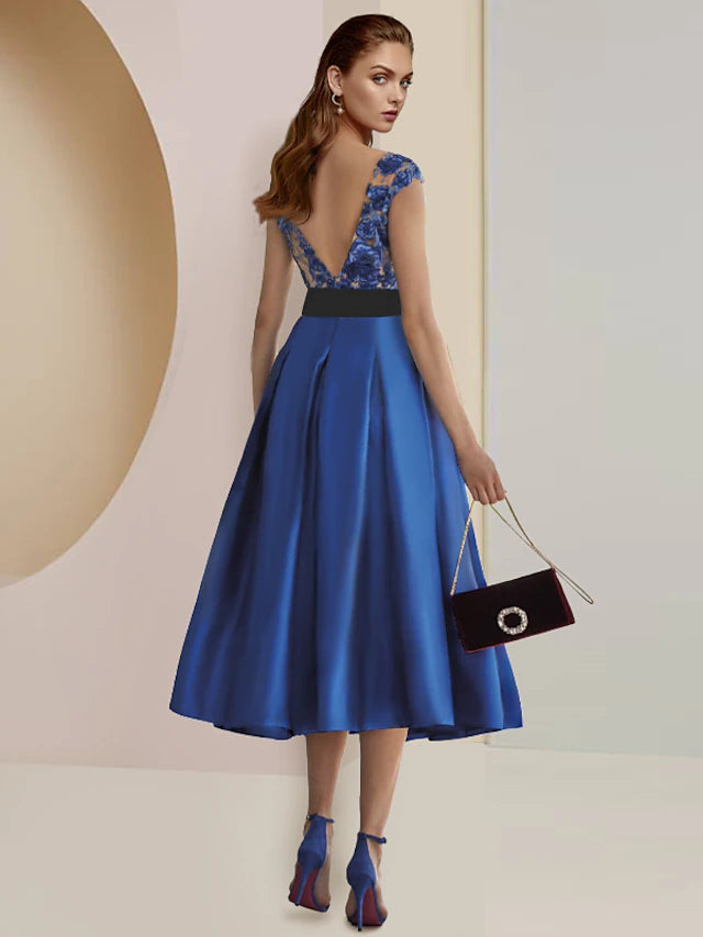 Tea length satin lace dress featuring pleats and appliques for formal events.