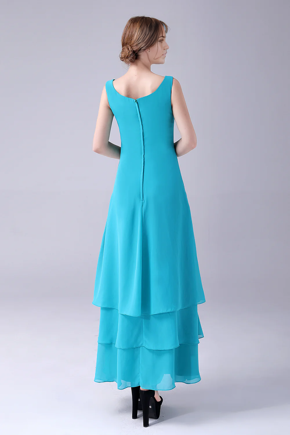 Detail of the flowing chiffon skirt on a blue A-line dress.