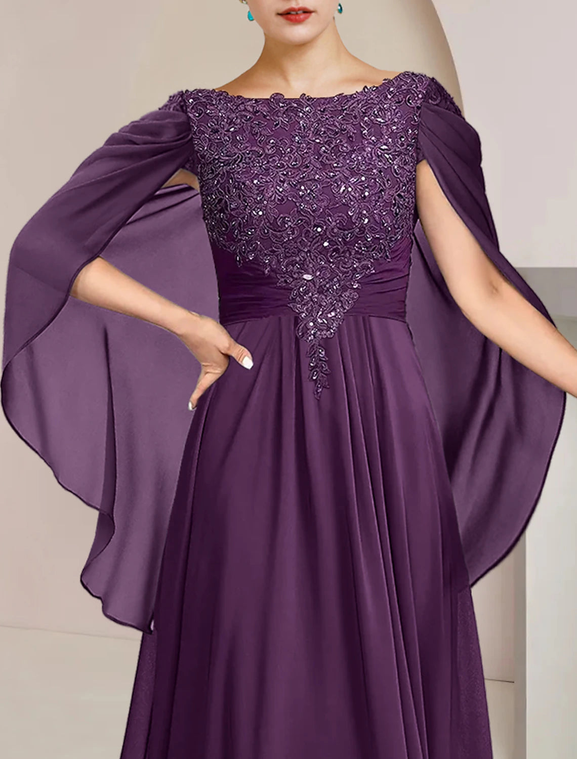 Side profile of the sleeveless A-Line formal wedding guest dress.