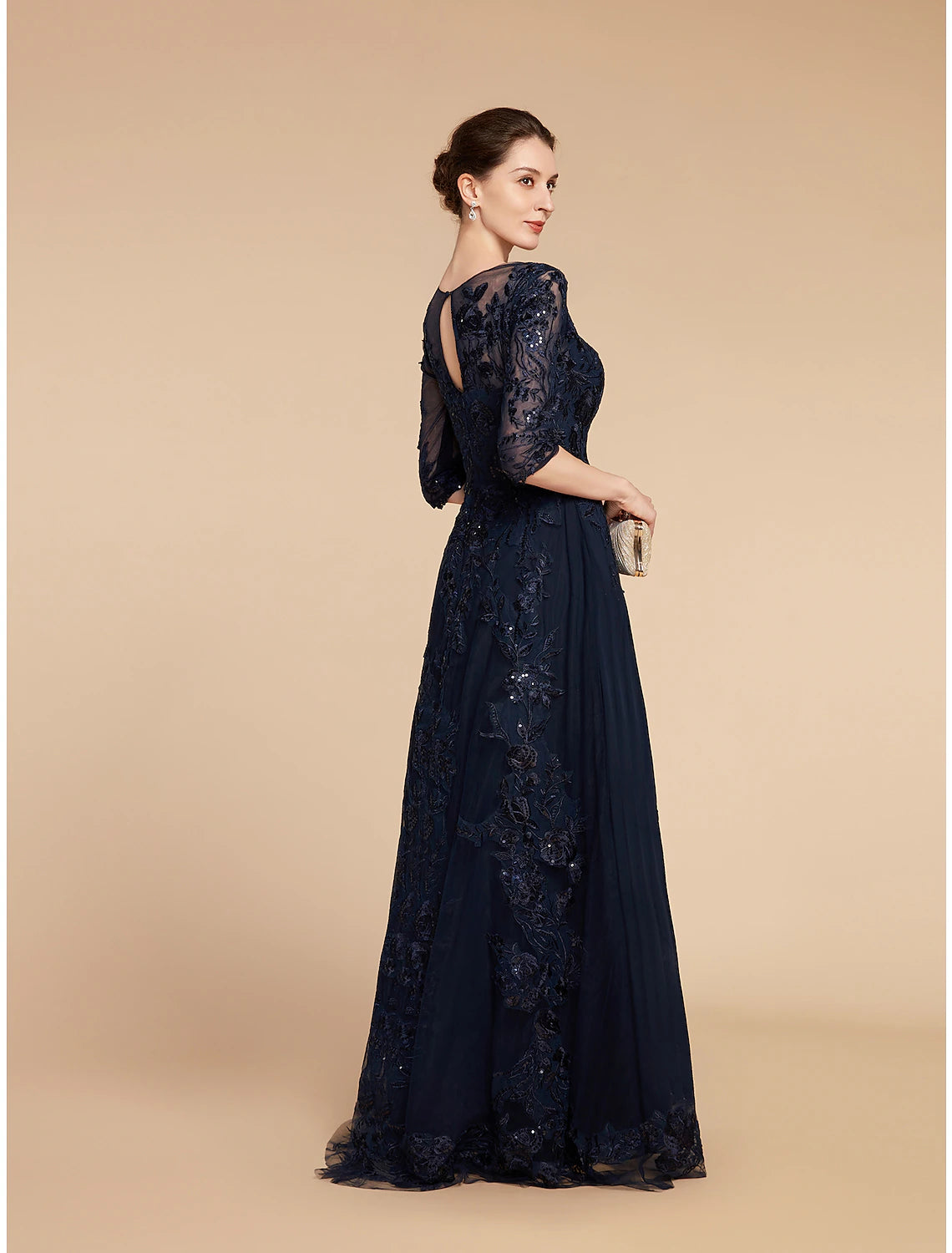 Close-up of sequin applique and lace fabric on the formal gown.