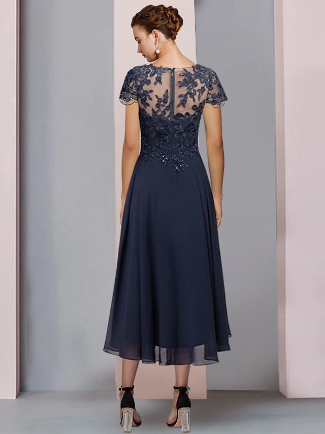Chiffon lace formal wedding guest dress featuring sequin appliques and a scoop neck.