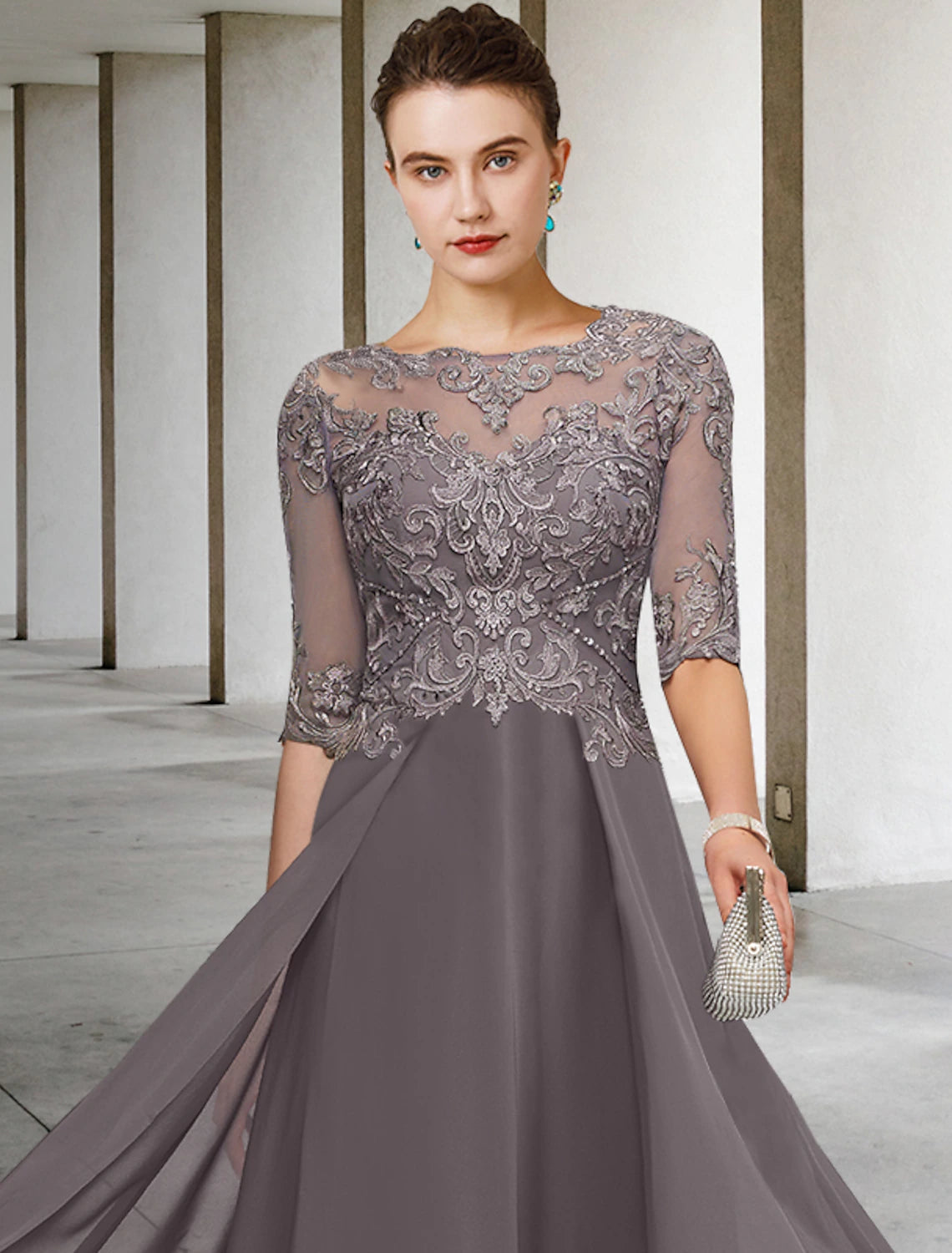 Close-up of the scoop neck, half sleeves, and intricate beading on the chiffon and lace fabric of the dress.